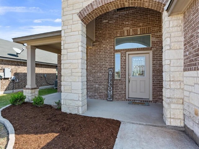 entrance to property featuring central AC unit