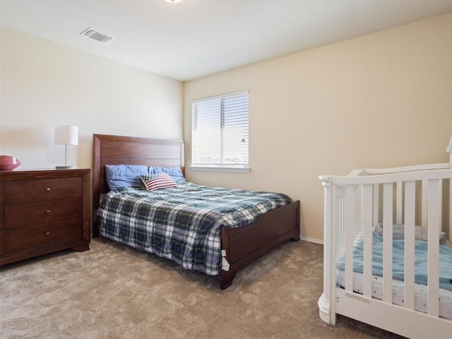 bedroom with light colored carpet