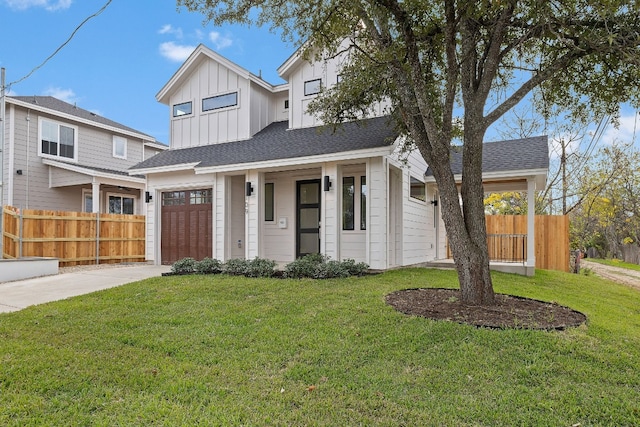 view of front of property with a porch, a front lawn, and a garage