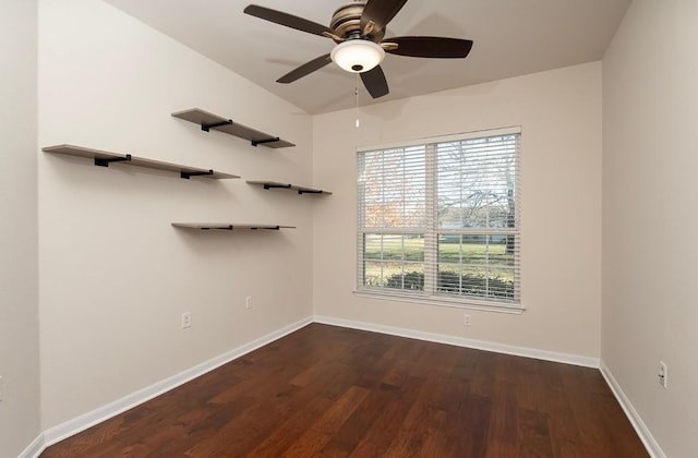 unfurnished room with ceiling fan and dark wood-type flooring