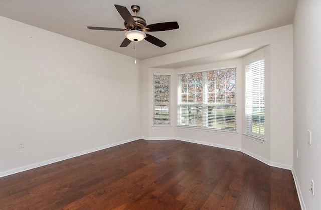 unfurnished room featuring ceiling fan and dark hardwood / wood-style floors