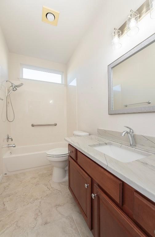 full bathroom featuring vanity, toilet, and tub / shower combination