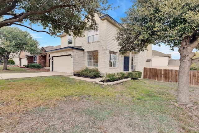 view of front of home featuring a garage and a front yard