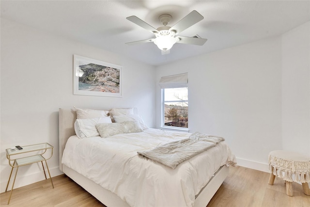 bedroom featuring ceiling fan and hardwood / wood-style flooring