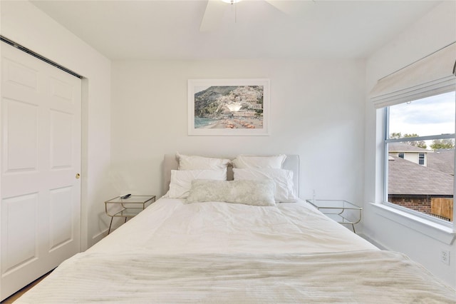 bedroom featuring ceiling fan and a closet