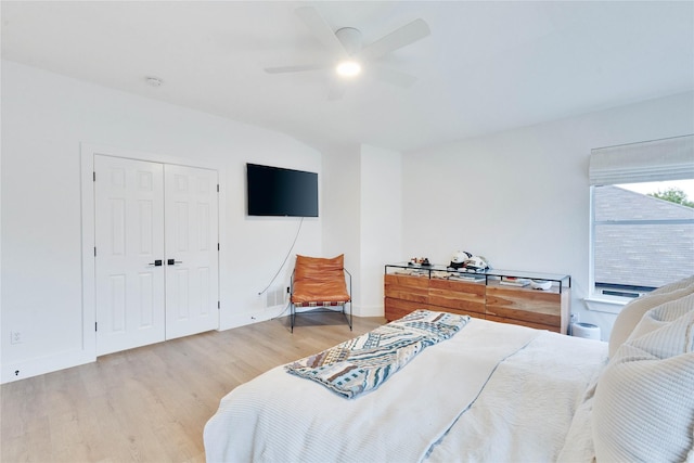 bedroom with ceiling fan, a closet, and light wood-type flooring