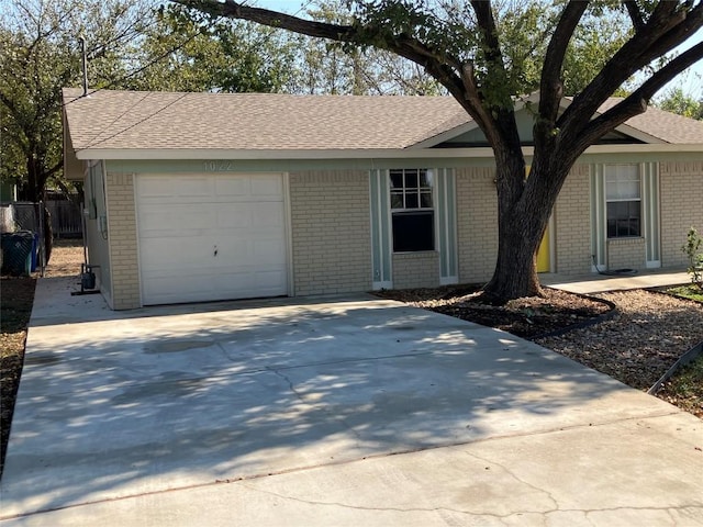 ranch-style house featuring a garage