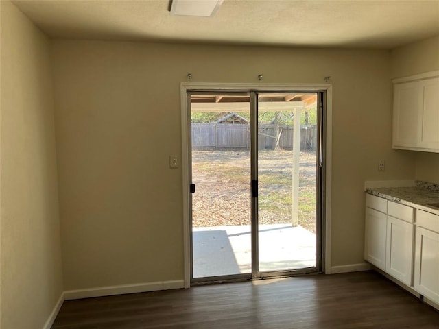 entryway with dark hardwood / wood-style floors