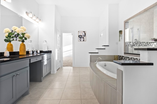 bathroom featuring tile patterned floors, vanity, and independent shower and bath