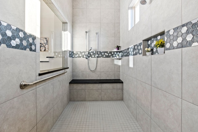 bathroom featuring a tile shower