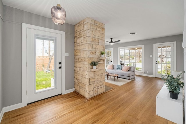 entryway with hardwood / wood-style flooring, ceiling fan, and a wealth of natural light