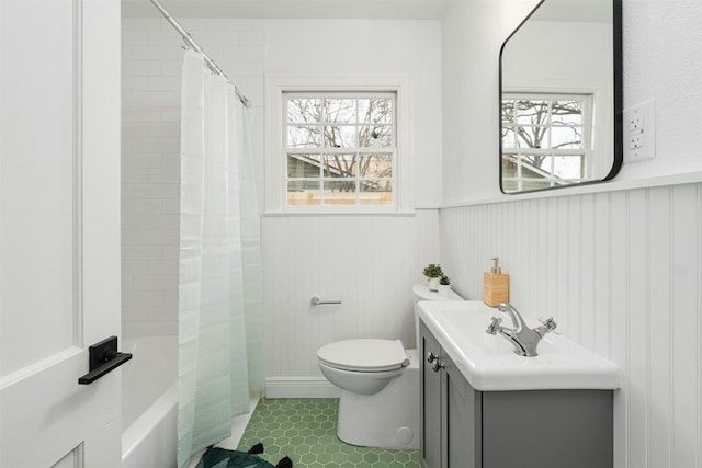 full bathroom with shower / bathtub combination with curtain, tile patterned flooring, wood walls, toilet, and vanity