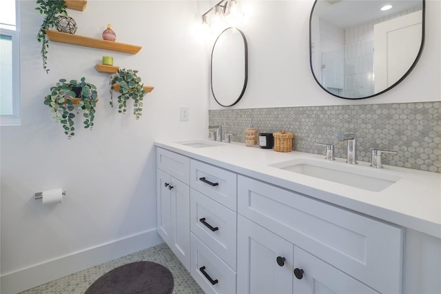 bathroom featuring tile patterned floors, decorative backsplash, and vanity