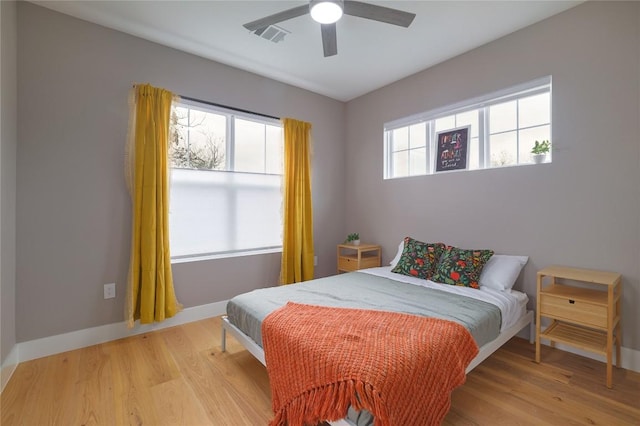 bedroom with hardwood / wood-style flooring and ceiling fan