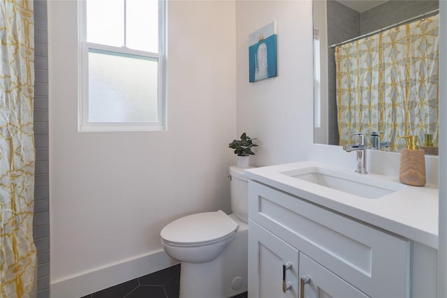 bathroom with tile patterned flooring, vanity, curtained shower, and toilet