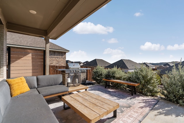 view of patio with grilling area and an outdoor living space