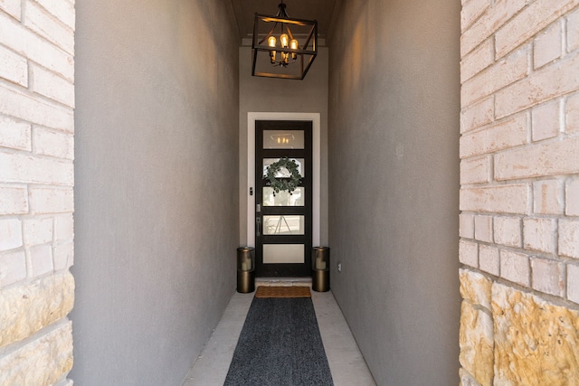 view of exterior entry featuring stucco siding