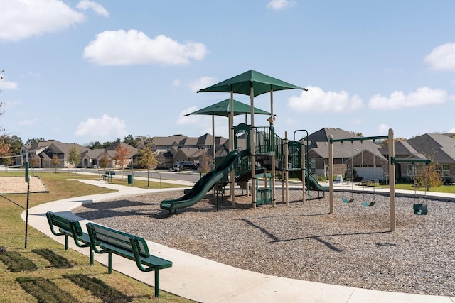 communal playground featuring a residential view