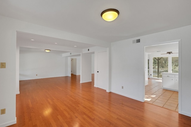 unfurnished room with light hardwood / wood-style floors