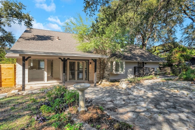 view of front of home featuring a patio and french doors