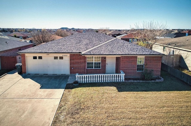 single story home featuring a front yard and a garage