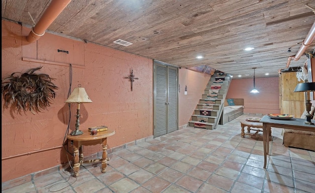 basement featuring wooden ceiling