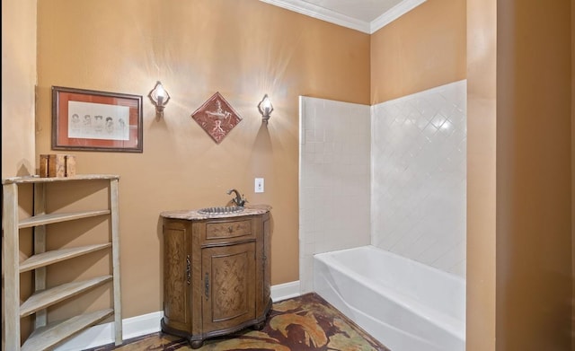 bathroom featuring vanity, crown molding, and a tub