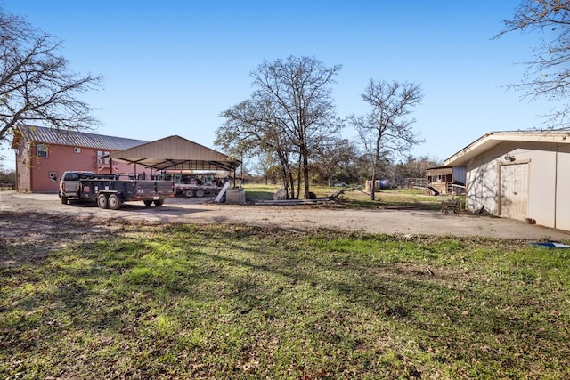 view of yard featuring a carport