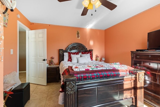 455 High View Ranch Dr, Cedar Creek, TX 78612 - bedroom featuring light tile patterned flooring, vaulted ceiling, and ceiling fan