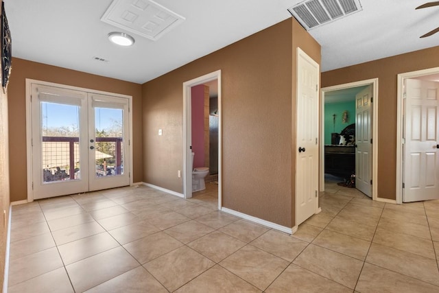 interior space featuring ceiling fan and french doors