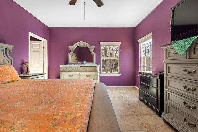 bedroom with ceiling fan and light tile patterned flooring