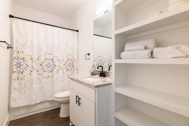 bathroom featuring a shower with curtain, vanity, wood-type flooring, and toilet