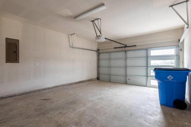 garage featuring electric panel and a garage door opener