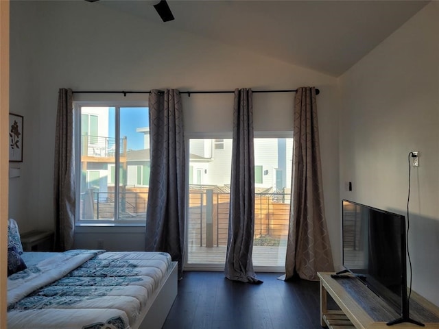 bedroom featuring ceiling fan, dark hardwood / wood-style floors, and lofted ceiling