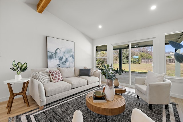 living room featuring hardwood / wood-style flooring and lofted ceiling with beams