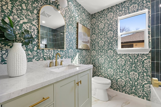 bathroom with vanity and toilet