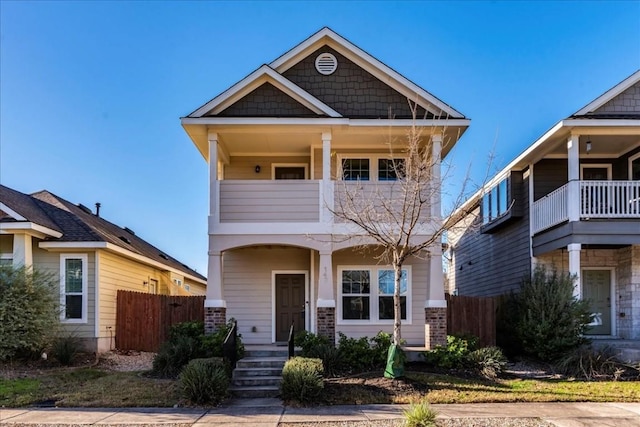 craftsman inspired home featuring a balcony