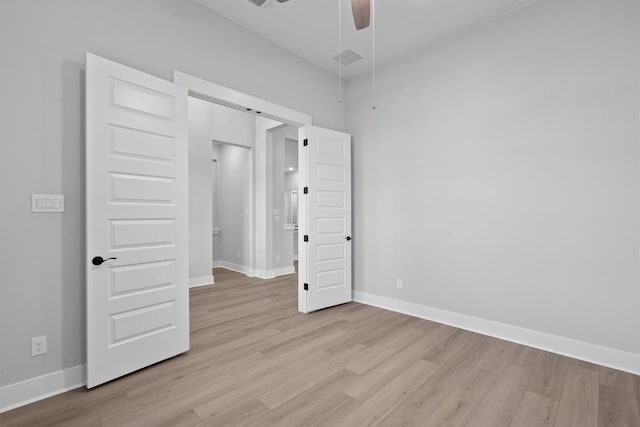 unfurnished bedroom featuring ceiling fan and light hardwood / wood-style floors