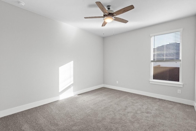 spare room with carpet flooring and ceiling fan