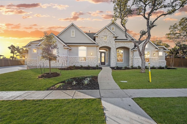 view of front of home with a yard