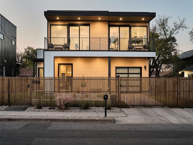 view of front of house featuring a balcony