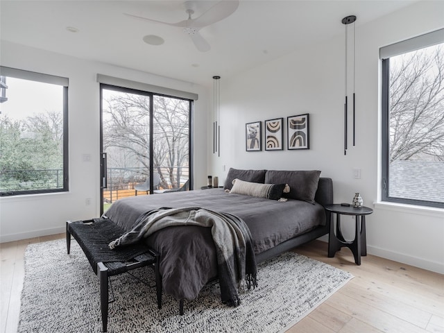 bedroom with light hardwood / wood-style floors and ceiling fan