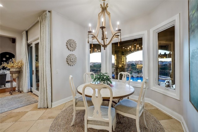 403 Rough Hollow Cv, Austin, TX 78734 - dining room with a chandelier and baseboards
