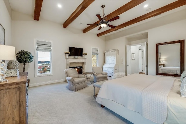 403 Rough Hollow Cv, Austin, TX 78734 - bedroom featuring carpet flooring, beam ceiling, a lit fireplace, baseboards, and recessed lighting
