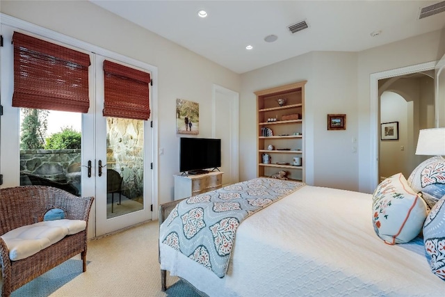 403 Rough Hollow Cv, Austin, TX 78734 - bedroom with access to exterior, light colored carpet, arched walkways, french doors, and recessed lighting