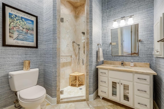 full bath with wallpapered walls, a stall shower, toilet, tile patterned floors, and vanity