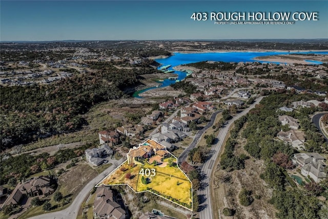 403 Rough Hollow Cv, Austin, TX 78734 - aerial view of residential area with a nearby body of water and property boundaries highlighted