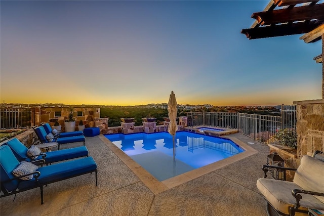 403 Rough Hollow Cv, Austin, TX 78734 - pool at dusk with an in-ground hot tub and a patio