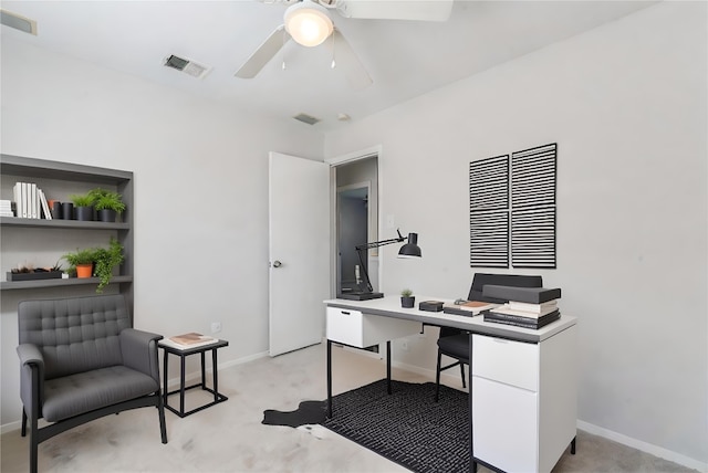 carpeted office featuring ceiling fan