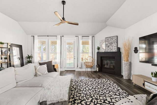 living room with lofted ceiling, dark wood-type flooring, and ceiling fan